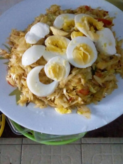 A picture of Fried Cabbage with boiled eggs.