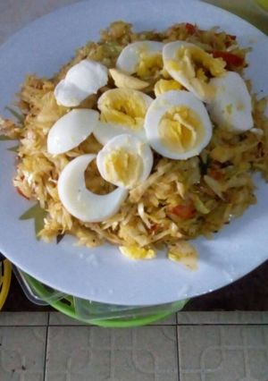 A picture of Fried Cabbage with boiled eggs.