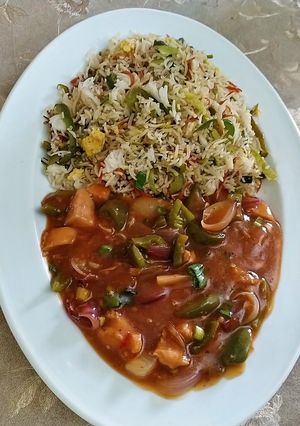 A picture of Fried rice with chicken shashlik.