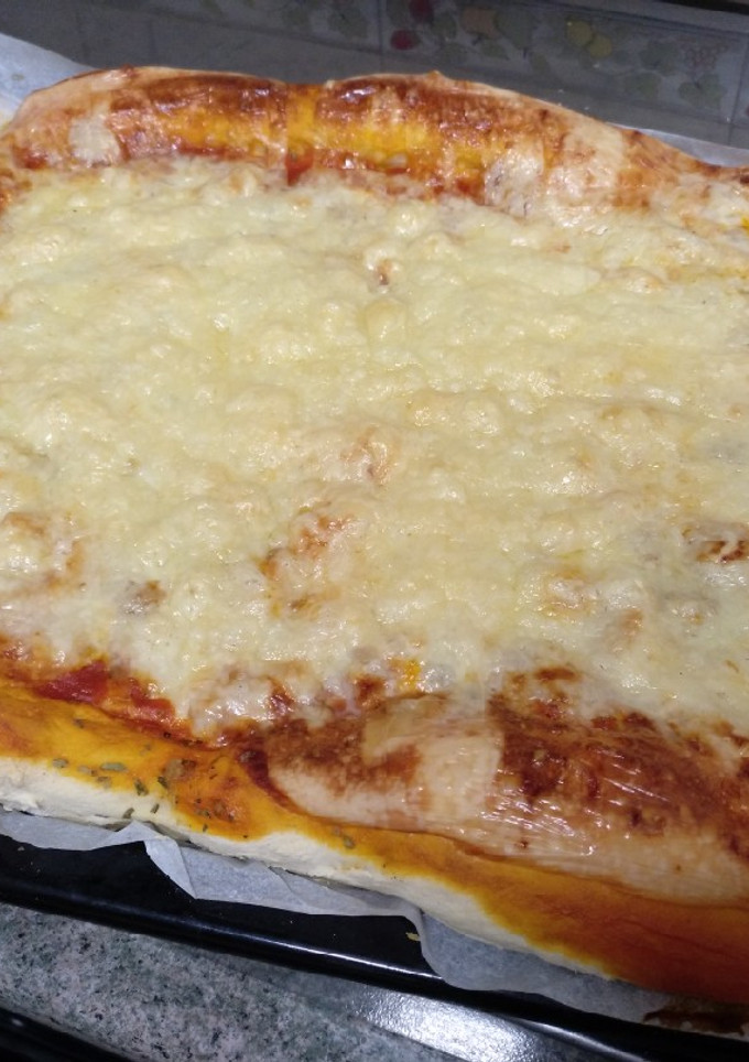 Una foto de Pizza muy esponjosa