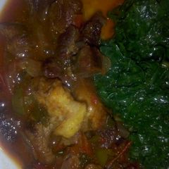 A picture of Beef stew with sauted kales.