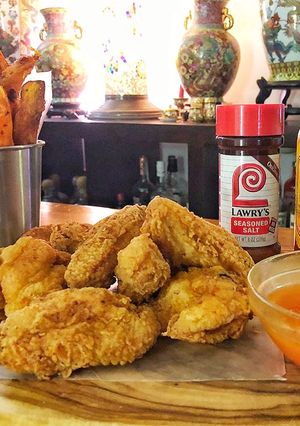 A picture of Fried Chicken Wings with Spicy Honey Butter.