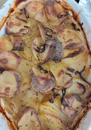 Une photo de Gratin de Pommes de Terre au Jus de Lapin Chasseur