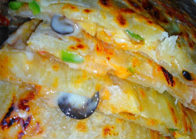 Recipe of Quick Pizratha (pizza paratha)