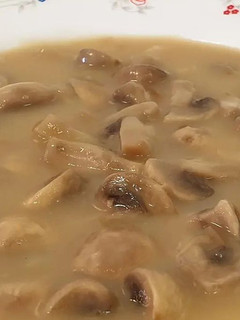 Una foto de Champiñones en salsa