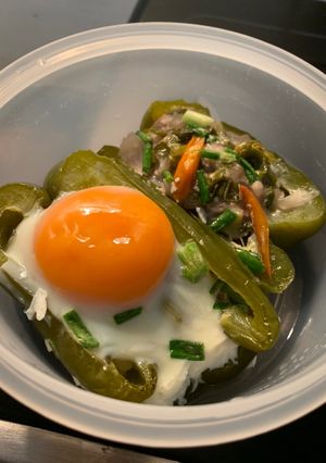 A picture of Baked Bell Peppers Stuffed with Ground Pork and Runny Egg.