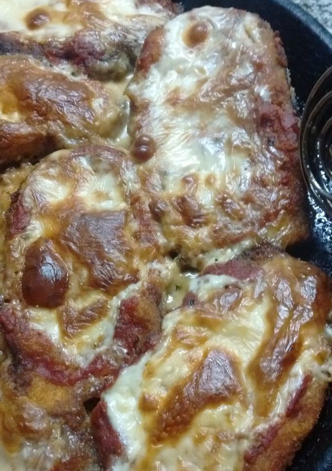 Una foto de Milanesas de berenjena a la napolitana