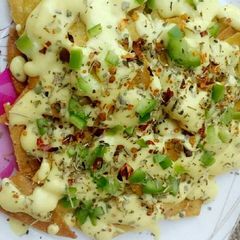 A picture of Nachos with Cheese .