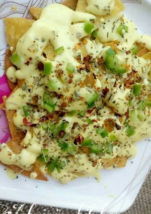 A picture of Nachos with Cheese .