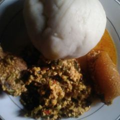 A picture of Pounded yam with vegetable egusi soup.