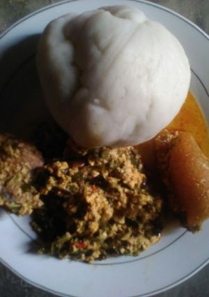 A picture of Pounded yam with vegetable egusi soup.