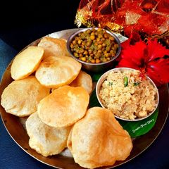 MahaPrasad Bhog / Halwa, Puri, Kala Chana A picture of MahaPrasad Bhog / Halwa, Puri, Kala Chana.