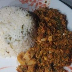 A picture of Rice & water leaf sauce.