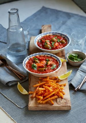 A picture of McCain Spicy Peri Peri Fries with Spanish Prawn Stew.