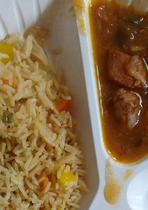 A picture of Vegetable rice and chicken stew.