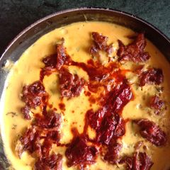 A picture of Kadhi pakoda with jeera rice.