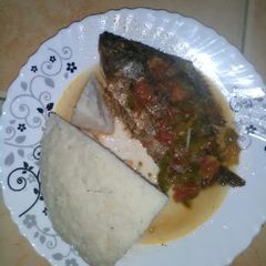 A picture of Fried fish with ugali.