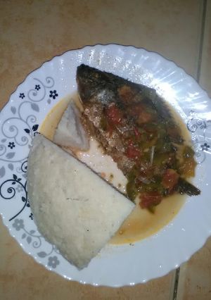 A picture of Fried fish with ugali.