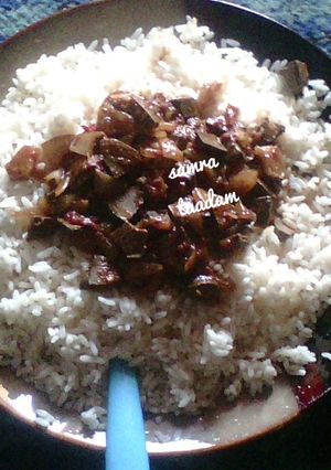 A picture of White rice with liver sauce.