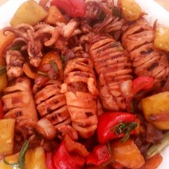 A picture of Grilled squid and stir fry vegetables.