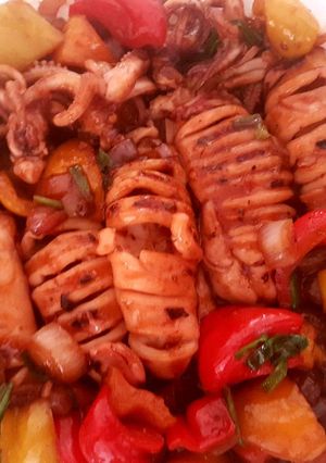 A picture of Grilled squid and stir fry vegetables.