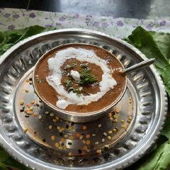A picture of Spinach tomato beetroot mix Dal soup.
