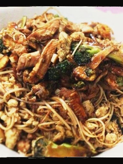 A picture of Broccoli and Chicken in Oyster-Soy Sauce with Shredded Egg Noodles.