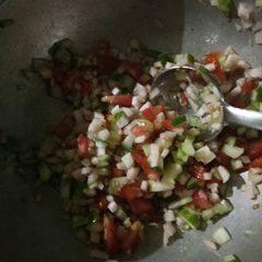 A picture of Tomato cucumber salad.
