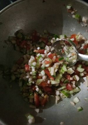 A picture of Tomato cucumber salad.