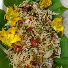 A picture of Pumpkin Flowers Fried Rice.