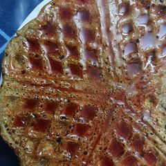A picture of Jackfruit flour Waffle with Strawberry syrup.