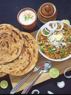 A picture of Paneer Bhurji With Masala Lachha Paratha.