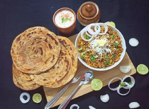 A picture of Paneer Bhurji With Masala Lachha Paratha.
