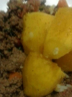 A picture of Steamed Potatoes and minced meat.