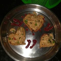 A picture of White sauce pasta cheese with little heart.