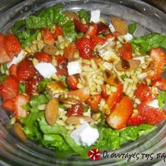 A picture of Salad with strawberries and feta cheese.