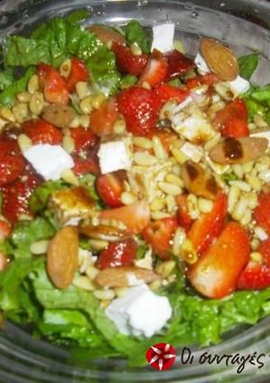 A picture of Salad with strawberries and feta cheese.