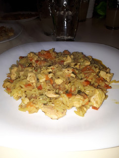 Una foto de Arroz con pollo curcumel