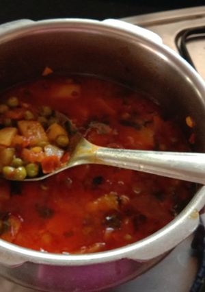 A picture of Aloo mutter and tomato sabji in pressure cooker.