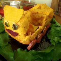 A picture of Crispy nachos cart with salsa, carrot wheels.