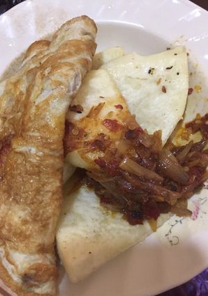 A picture of Fried yam,egg with onion sauce.
