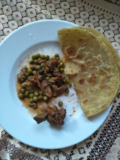 A picture of Minji beef stew with chapati.