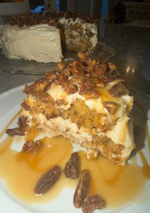 A picture of Best Ever Carrot Cake with Bourbon Buttermilk Caramel Sauce and Candied Bourbon Pecans.