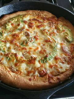 A picture of Homemade Deep Dish Pizza in a Cast Iron Skillet.