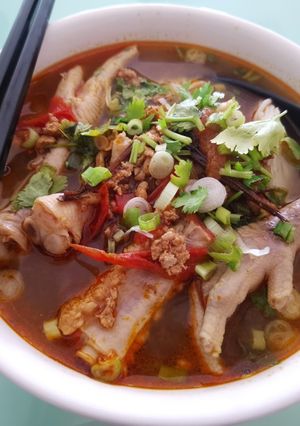 A picture of Khanom Jeen Nam Ngiao (Northern Thai Noodle Soup).