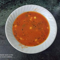 A picture of Tomato Carrot Corn soup with some roasted jeera flavour.