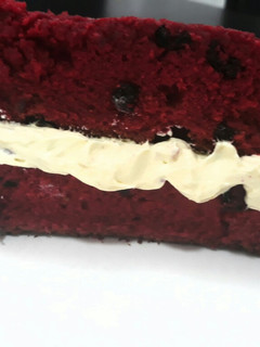 A picture of Red velvet cake with dry mixed fruits.