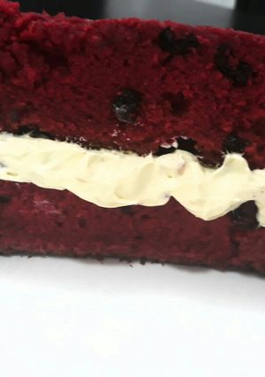A picture of Red velvet cake with dry mixed fruits.