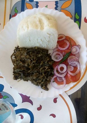 A picture of Coconut cooked managu/osuga/mnavu and ugali.
