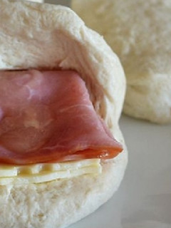 A picture of Bombs with cheese and ham.